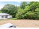 Large backyard with a shed, providing ample space for gardening and recreation at 1047 |1049 E Harnett St, Dunn, NC 28334