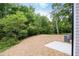 Serene backyard with mature trees, offering a private outdoor oasis, ideal for relaxation at 1047 |1049 E Harnett St, Dunn, NC 28334