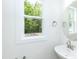 Well-lit bathroom with modern fixtures and a large window at 1047 |1049 E Harnett St, Dunn, NC 28334