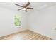 Bedroom with ceiling fan and a window with a view at 1047 |1049 E Harnett St, Dunn, NC 28334