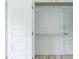 Bright, minimalist closet space with wood clothing racks at 1047 |1049 E Harnett St, Dunn, NC 28334