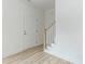 Bright entryway with stairs and a white door at 1047 |1049 E Harnett St, Dunn, NC 28334