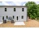 Gray two-story house exterior showing a back patio and HVAC unit at 1047 |1049 E Harnett St, Dunn, NC 28334