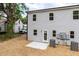 Gray two-story house exterior with a walk-out patio, HVAC unit, and new landscaping at 1047 |1049 E Harnett St, Dunn, NC 28334