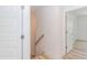 Hallway with stairs and a view of an open doorway to another room at 1047 |1049 E Harnett St, Dunn, NC 28334