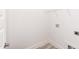Minimalist laundry room with shelving and utility connections at 1047 |1049 E Harnett St, Dunn, NC 28334