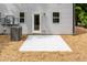 Backyard patio with light gray siding and two A/C units at 1047 |1049 E Harnett St, Dunn, NC 28334