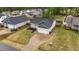 This aerial showcases the home, driveway, and its placement within a friendly neighborhood at 105 Jasper Creek Ct, Wilson's Mills, NC 27520