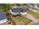 Aerial view of a charming home with a manicured lawn and a two car garage in a quiet neighborhood at 105 Jasper Creek Ct, Wilson's Mills, NC 27520