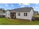 Well-maintained backyard featuring a screened porch and lush lawn at 105 Jasper Creek Ct, Wilson's Mills, NC 27520
