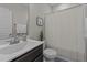 Bathroom with a combined shower and tub, a modern sink, and neutral color scheme at 105 Jasper Creek Ct, Wilson's Mills, NC 27520