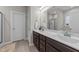 Bathroom featuring double sinks with a spacious vanity and a walk-in shower at 105 Jasper Creek Ct, Wilson's Mills, NC 27520