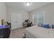 Comfortable bedroom with neutral tones, a large window, and ample closet space at 105 Jasper Creek Ct, Wilson's Mills, NC 27520