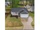 Charming home with well-maintained lawn, a driveway, a covered front porch, and an attached two-car garage at 105 Jasper Creek Ct, Wilson's Mills, NC 27520