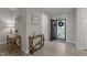 Bright foyer with wood-look flooring, decorated with stylish furniture and a welcoming, open ambiance at 105 Jasper Creek Ct, Wilson's Mills, NC 27520