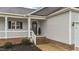 Inviting front porch featuring decorative accents, providing a warm welcome to visitors and residents at 105 Jasper Creek Ct, Wilson's Mills, NC 27520
