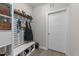Inviting mudroom with custom shelving, seating, and stylish design elements at 105 Jasper Creek Ct, Wilson's Mills, NC 27520