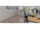 Office space with neutral colored walls and natural light from the window at 105 Jasper Creek Ct, Wilson's Mills, NC 27520