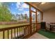 Relaxing screened porch with outdoor views of the yard and neighborhood at 105 Jasper Creek Ct, Wilson's Mills, NC 27520