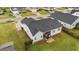 Aerial view of the home's rear exterior with a screened-in porch, patio, and well-maintained lawn and partial fence at 105 Jasper Creek Ct, Wilson's Mills, NC 27520