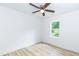 Bright bedroom with a ceiling fan, neutral walls, and wood-look floors at 1057 |1059 E Harnett St, Dunn, NC 28334