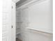Well-organized closet with white shelving and hanging rods for optimal storage and organization at 1057 |1059 E Harnett St, Dunn, NC 28334