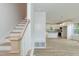 Spacious entryway boasts stairs, coat rack, and open view of the kitchen at 1057 |1059 E Harnett St, Dunn, NC 28334