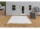 Exterior patio area with backyard access to the home with white patio and well kept lawn at 1057 |1059 E Harnett St, Dunn, NC 28334