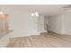 Spacious living room with views of the kitchen, stairs, and white doors at 1057 |1059 E Harnett St, Dunn, NC 28334
