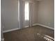 Bedroom with neutral tones, carpet flooring, and a window at 108 W Savannah Ridge Rd, Holly Springs, NC 27540