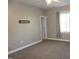 Neutral bedroom features a ceiling fan and ample natural light from the window at 108 W Savannah Ridge Rd, Holly Springs, NC 27540