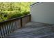 Outdoor wooden deck surrounded by lush greenery, providing a private retreat at 108 W Savannah Ridge Rd, Holly Springs, NC 27540