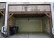 Garage with one door for parking and storage, featuring a covered structure at 108 W Savannah Ridge Rd, Holly Springs, NC 27540