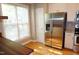 Bright kitchen featuring stainless steel fridge, ample cabinet space, and natural light at 108 W Savannah Ridge Rd, Holly Springs, NC 27540