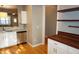 Bright kitchen featuring stainless steel appliances, granite countertops, and hardwood floors at 108 W Savannah Ridge Rd, Holly Springs, NC 27540