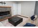 Cozy living room featuring comfortable seating, accent pillows, and a fireplace for relaxation at 108 W Savannah Ridge Rd, Holly Springs, NC 27540