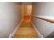 Staircase with wooden steps and a handrail, leading to the upper or lower level of the house at 108 W Savannah Ridge Rd, Holly Springs, NC 27540