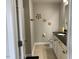 Bathroom features a black granite counter, white cabinets, and decorative flowers on the wall at 1129 Kudzu St, Durham, NC 27713