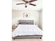 Spacious bedroom featuring neutral walls and carpet, two side tables, and a ceiling fan at 1129 Kudzu St, Durham, NC 27713