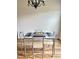 Chic dining area with a glass-top table and seating creating an ideal space for meals at 1129 Kudzu St, Durham, NC 27713