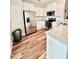 Well-lit kitchen boasts stainless steel appliances, granite countertops, and modern cabinets at 1129 Kudzu St, Durham, NC 27713