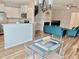 Inviting open-concept layout with a kitchen, living area, and dining space creating a harmonious flow at 1129 Kudzu St, Durham, NC 27713