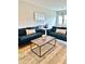 Cozy living room featuring stylish sofas, a coffee table, and a comfortable atmosphere at 1129 Kudzu St, Durham, NC 27713