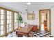 Sun-drenched breakfast nook with checkered floors and French doors leading to the outside at 1208 College Pl, Raleigh, NC 27605
