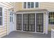 Covered porch with sliding screen doors at 1208 College Pl, Raleigh, NC 27605