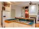 Kitchen features white cabinets, a tile countertop, and modern appliances at 1208 College Pl, Raleigh, NC 27605