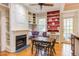 Living room boasts custom built-ins, a cozy fireplace and hardwood floors at 1208 College Pl, Raleigh, NC 27605