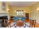 A living room featuring light yellow walls, hardwood floors, and traditional furniture at 1208 College Pl, Raleigh, NC 27605