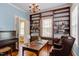 Library with hardwood floors, bookshelves, large window with lots of sunlight, and classic finishes at 1208 College Pl, Raleigh, NC 27605