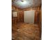 Bedroom with wood paneled walls and ceiling damage at 1210 Cypress St, Rocky Mount, NC 27801